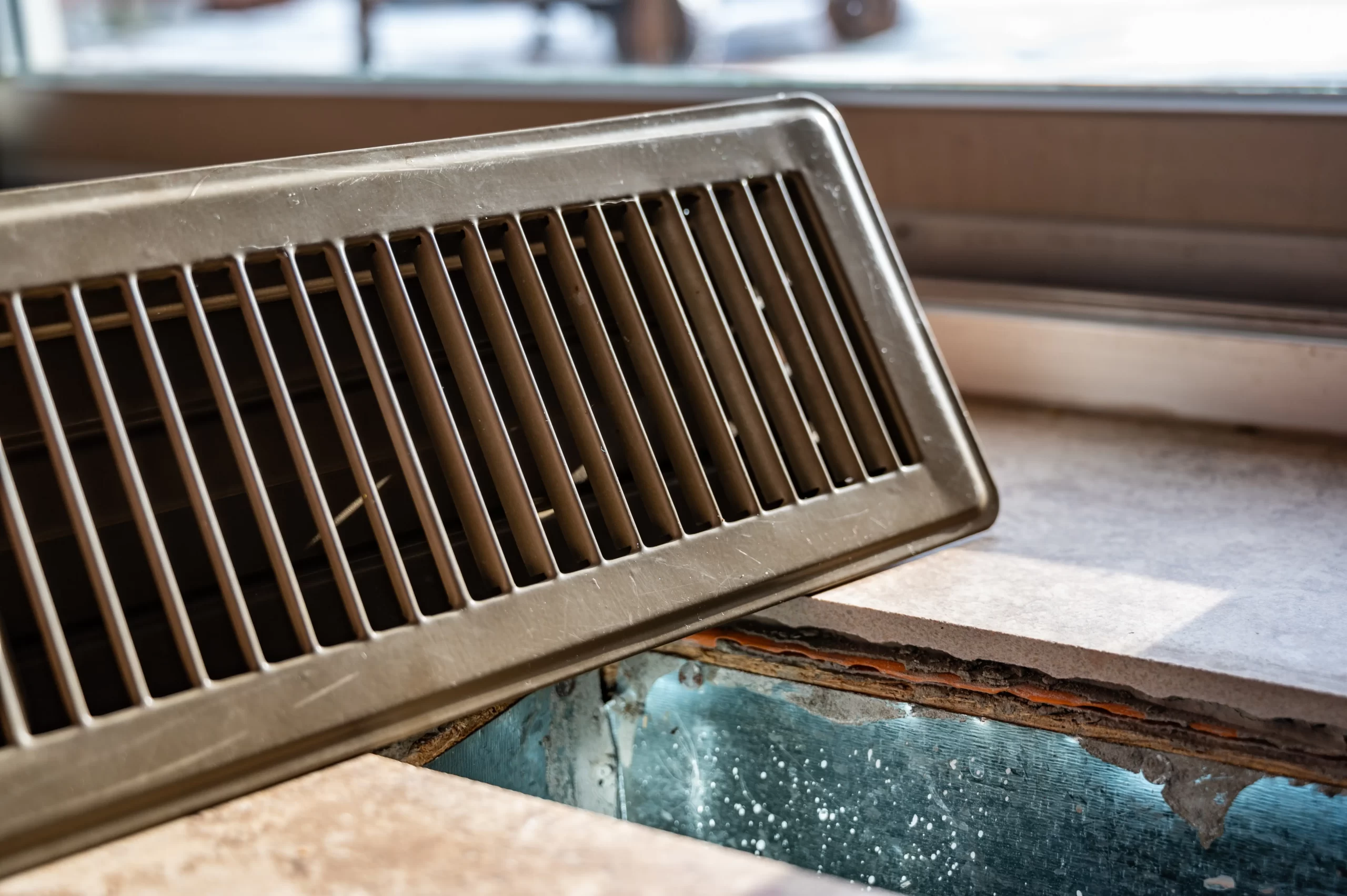 Homeowner enjoying fresh indoor air after professional duct cleaning