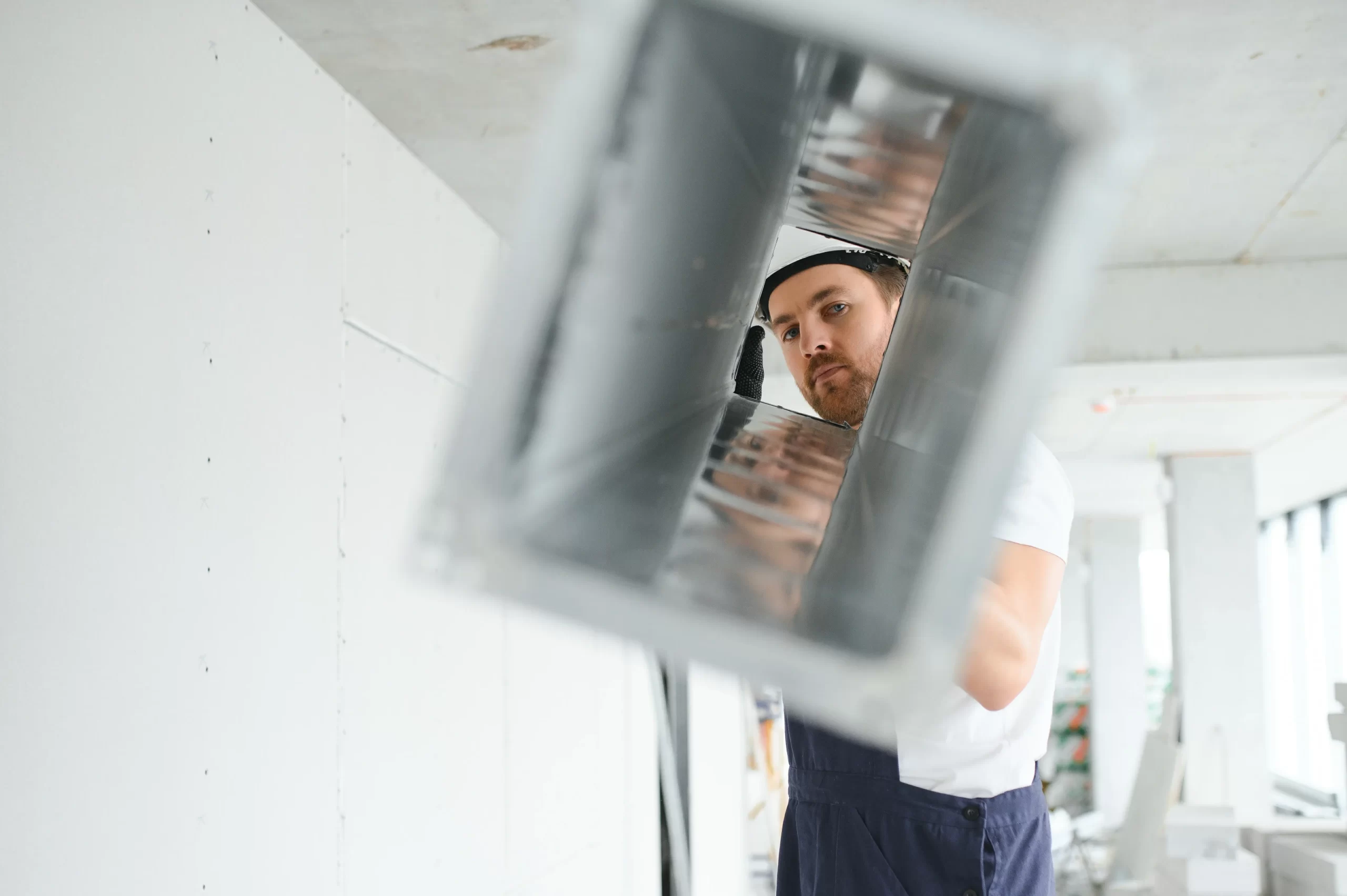 Technician inspecting HVAC blower assembly