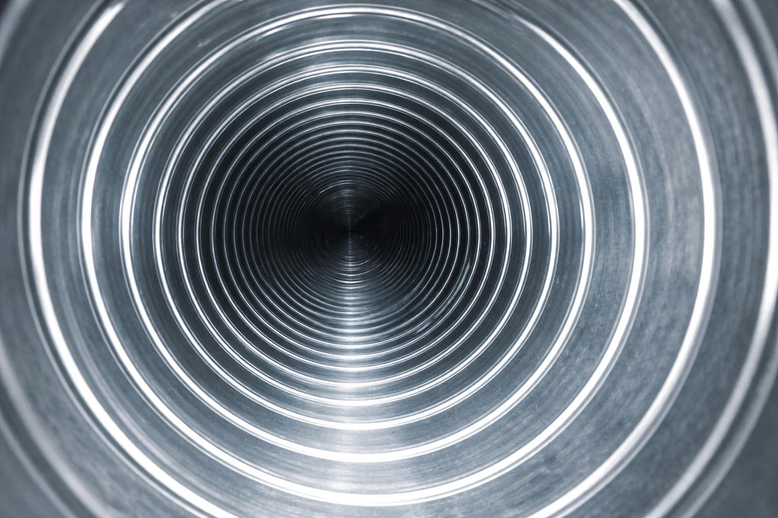 Inside a dryer vent duct after cleaning with clear, smooth metal interior
