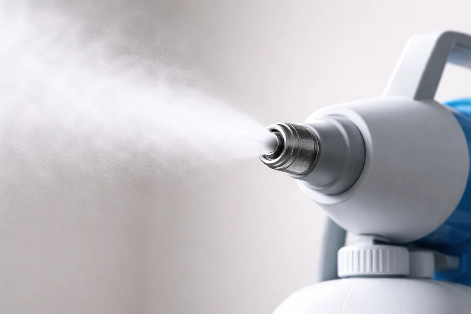 Close-up of an ULV fogger producing a fine disinfectant mist for surface coverage